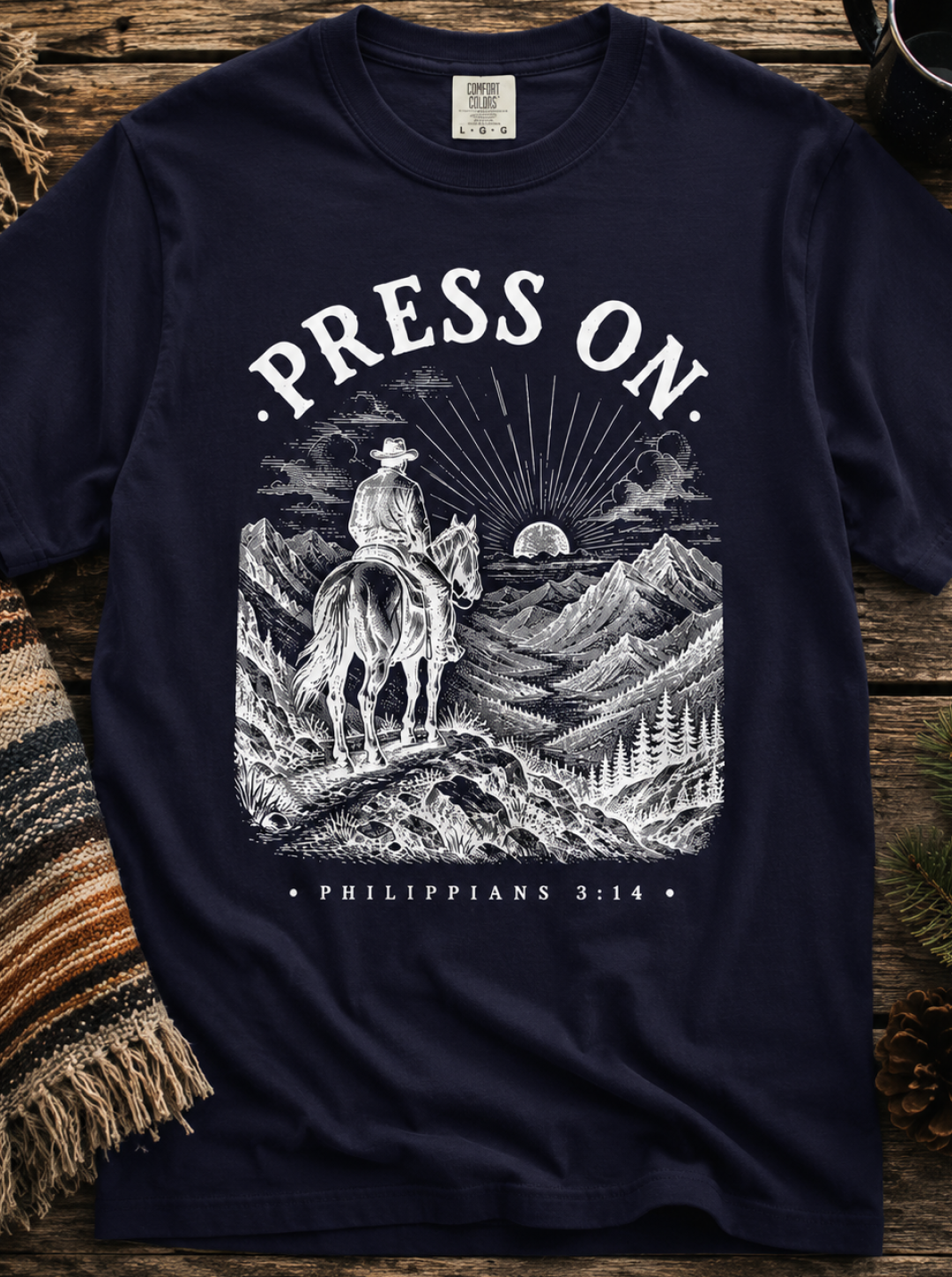 Press On T‑Shirt — Christian Cowboy Mountain Graphic (Philippians 3:14)